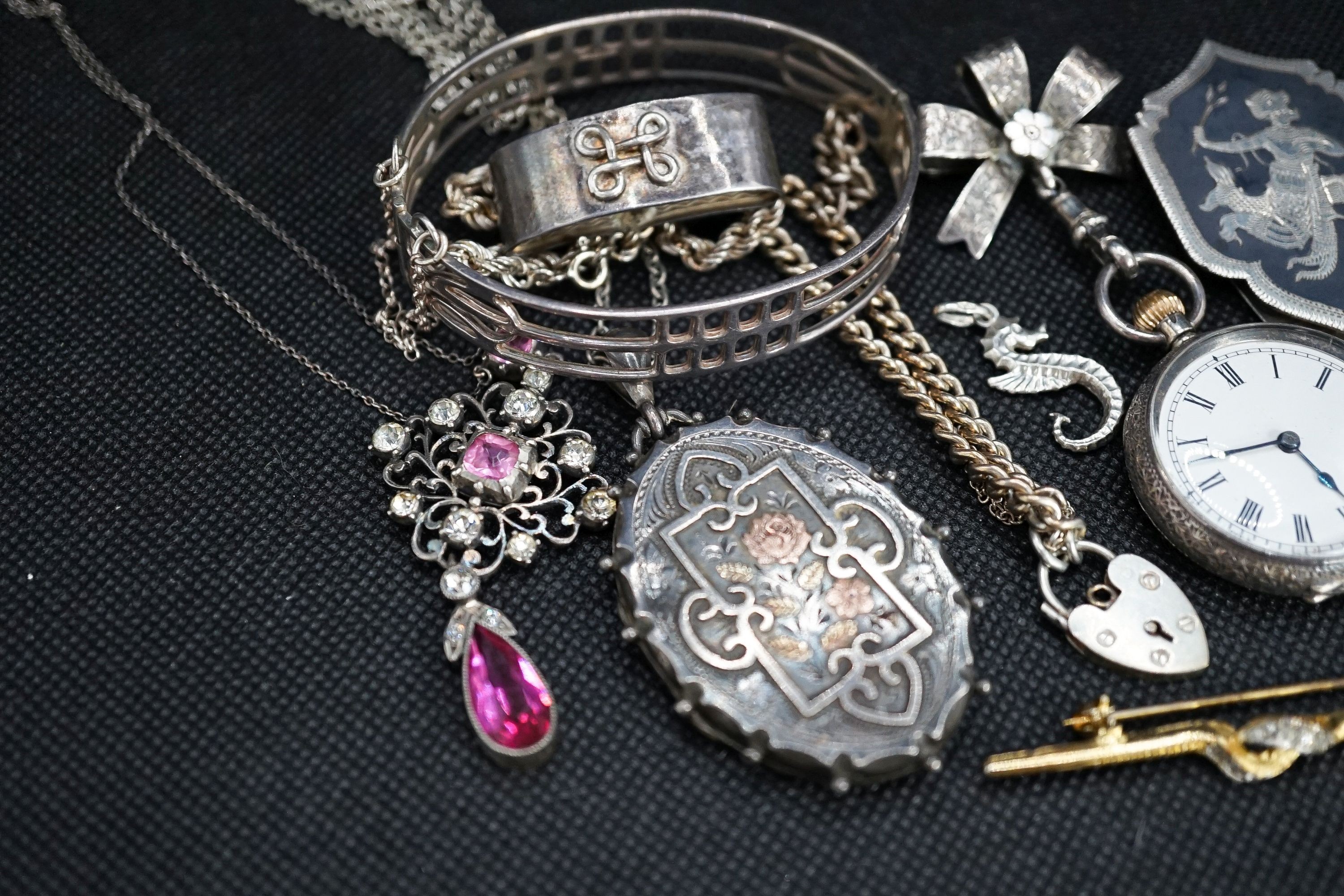 A silver fob watch, a late Victorian silver oval locket and other items of minor jewellery.